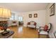 Elegant living room with neutral tones, hardwood floors, and an archway leading to additional living space at 2125 Shenandoah Ave, Charlotte, NC 28205