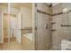 Walk-in shower and tub in the neutral toned bathroom at 2125 Shenandoah Ave, Charlotte, NC 28205
