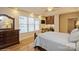 A main bedroom features natural light, hardwood floors, and a desk area at 2125 Shenandoah Ave, Charlotte, NC 28205
