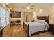 A spacious bedroom with hardwood floors, a desk area, and natural light at 2125 Shenandoah Ave, Charlotte, NC 28205