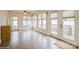 Spacious sun room featuring tile flooring, ceiling fans, and access to the deck at 2125 Shenandoah Ave, Charlotte, NC 28205