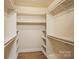Spacious walk-in closet offers plenty of storage space and shelving at 2125 Shenandoah Ave, Charlotte, NC 28205