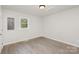 A well-lit bedroom showcasing wood-look floors and a window view at 235 8Th Avenue Sw Dr, Hickory, NC 28602