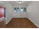 Bright living room with hardwood floors and natural light from double windows at 26017 Misty Way Dr, Fort Mill, SC 29708