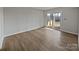 Living room with laminate flooring and a sliding glass door to a patio at 26017 Misty Way Dr, Fort Mill, SC 29708