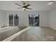 Bright living room featuring sliding glass doors to an outdoor deck at 26017 Misty Way Dr, Fort Mill, SC 29708