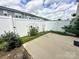 Cozy fenced backyard with a concrete patio and minimal landscaping, perfect for relaxing at 2692 Norman Isle Dr, Denver, NC 28037