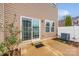 Back of house featuring a sliding glass door leading to a concrete patio and fenced yard at 2692 Norman Isle Dr, Denver, NC 28037