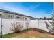 Fenced backyard featuring a concrete patio and views of adjacent townhomes at 2692 Norman Isle Dr, Denver, NC 28037