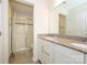 Bright bathroom with a double sink vanity, granite countertop and a glass enclosed tiled shower at 2692 Norman Isle Dr, Denver, NC 28037