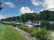 Picturesque boat docks with boats, lush greenery and rocks along the water's edge create a serene waterfront view at 2692 Norman Isle Dr, Denver, NC 28037