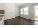 Dining area features hardwood flooring and natural light through two windows at 2692 Norman Isle Dr, Denver, NC 28037