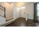 Inviting entryway with hardwood floors, carpeted stairs, and ample natural light at 2692 Norman Isle Dr, Denver, NC 28037