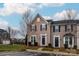 Two-story townhome with neutral siding, black shutters and roof, and a well-manicured lawn at 2692 Norman Isle Dr, Denver, NC 28037