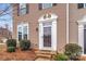 Elegant front entrance featuring a white door frame and decorative landscaping at 2692 Norman Isle Dr, Denver, NC 28037