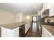 Modern kitchen features stainless appliances, a large granite island, and an open-concept design at 2692 Norman Isle Dr, Denver, NC 28037