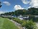 Picturesque lake view with docked boats, lush greenery, and a clear blue sky at 2692 Norman Isle Dr, Denver, NC 28037