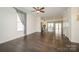 Open-concept living area with hardwood floors and seamless flow to the kitchen at 2692 Norman Isle Dr, Denver, NC 28037