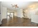 Spacious living room with hardwood floors, a ceiling fan, and staircase access at 2692 Norman Isle Dr, Denver, NC 28037