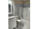 Clean bathroom with a combined shower and tub, a tiled floor, and a granite sink countertop at 309 General As Johnston St, Stanley, NC 28164