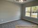 Cozy bedroom with plush carpeting, ceiling fan, and natural light from the exterior at 309 General As Johnston St, Stanley, NC 28164