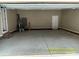 Spacious two-car garage featuring ample storage space and neutral color palette at 309 General As Johnston St, Stanley, NC 28164