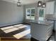 Bright kitchen featuring an island, stainless appliances, and natural light from a window at 309 General As Johnston St, Stanley, NC 28164