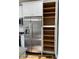 Modern kitchen featuring stainless steel appliances and ample pantry space with custom shelving at 309 General As Johnston St, Stanley, NC 28164