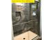 Bathroom shower featuring gray tile and shampoo nook at 309 General As Johnston St, Stanley, NC 28164