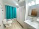 Neat bathroom featuring a shower with curtain, toilet, modern vanity, and bright lighting at 32341 Speiss Rd, Albemarle, NC 28001