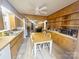 Spacious kitchen and dining area featuring wood-look floors and plenty of natural light, perfect for Gathering meals at 32341 Speiss Rd, Albemarle, NC 28001