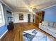 Inviting living room featuring hardwood floors, a stylish rug, and a cozy gray sofa with accent pillows at 32341 Speiss Rd, Albemarle, NC 28001
