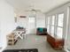 Bright and airy sun room perfect for relaxation, featuring a wooden bench and ample natural light at 32341 Speiss Rd, Albemarle, NC 28001