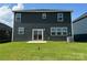 Spacious backyard with a lush green lawn, perfect for outdoor activities and relaxation at 330 Knotty Wood Dr # 67, Monroe, NC 28110