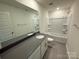 This well lit bathroom offers a clean, modern design with combination shower and bath at 330 Knotty Wood Dr # 67, Monroe, NC 28110