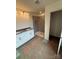 A bathroom featuring a vanity with double sinks and a walk-in shower with gray tile walls at 330 Knotty Wood Dr # 67, Monroe, NC 28110