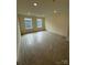 Bright bedroom with two windows and carpeting at 330 Knotty Wood Dr # 67, Monroe, NC 28110