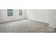 Bedroom featuring neutral carpet and two windows at 330 Knotty Wood Dr # 67, Monroe, NC 28110
