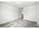 Unfurnished bedroom with neutral walls, carpet, and standard closet doors at 330 Knotty Wood Dr # 67, Monroe, NC 28110