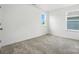 Bright bedroom featuring plush carpeting and two windows, providing natural light at 330 Knotty Wood Dr # 67, Monroe, NC 28110
