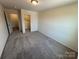 A spacious bedroom has an attached closet, new carpeting, and plenty of natural light at 330 Knotty Wood Dr # 67, Monroe, NC 28110