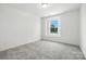 Cozy bedroom with neutral carpeting and a view from the window at 330 Knotty Wood Dr # 67, Monroe, NC 28110