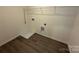 A walk-in closet featuring laminate flooring and shelving is ideal for storage needs at 330 Knotty Wood Dr # 67, Monroe, NC 28110