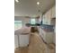 Bright, open kitchen with white cabinetry, a center island, and stainless steel appliances at 330 Knotty Wood Dr # 67, Monroe, NC 28110