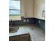 Close-up view of the kitchen counter with a sleek faucet, subway tile backsplash, and ample counter space at 330 Knotty Wood Dr # 67, Monroe, NC 28110