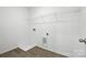 Utility room with a floor drain and hook-ups for a washer and dryer at 330 Knotty Wood Dr # 67, Monroe, NC 28110