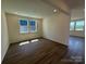 Well-lit living room with hardwood floors and ample natural light from the windows at 330 Knotty Wood Dr # 67, Monroe, NC 28110