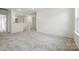 Loft space with neutral carpet and access to upstairs rooms at 330 Knotty Wood Dr # 67, Monroe, NC 28110