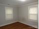 Bedroom with neutral paint, hardwood floors, and natural light from the windows at 3628 Michigan Ave, Charlotte, NC 28215