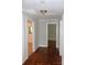 Bright hallway with hardwood floors and fresh white trim at 3628 Michigan Ave, Charlotte, NC 28215